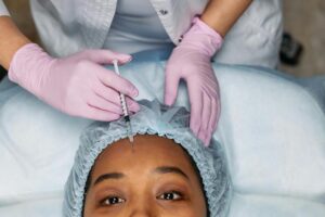 Doctor performing Botox forehead injection at Bespoke Medical Aesthetics in Colchester