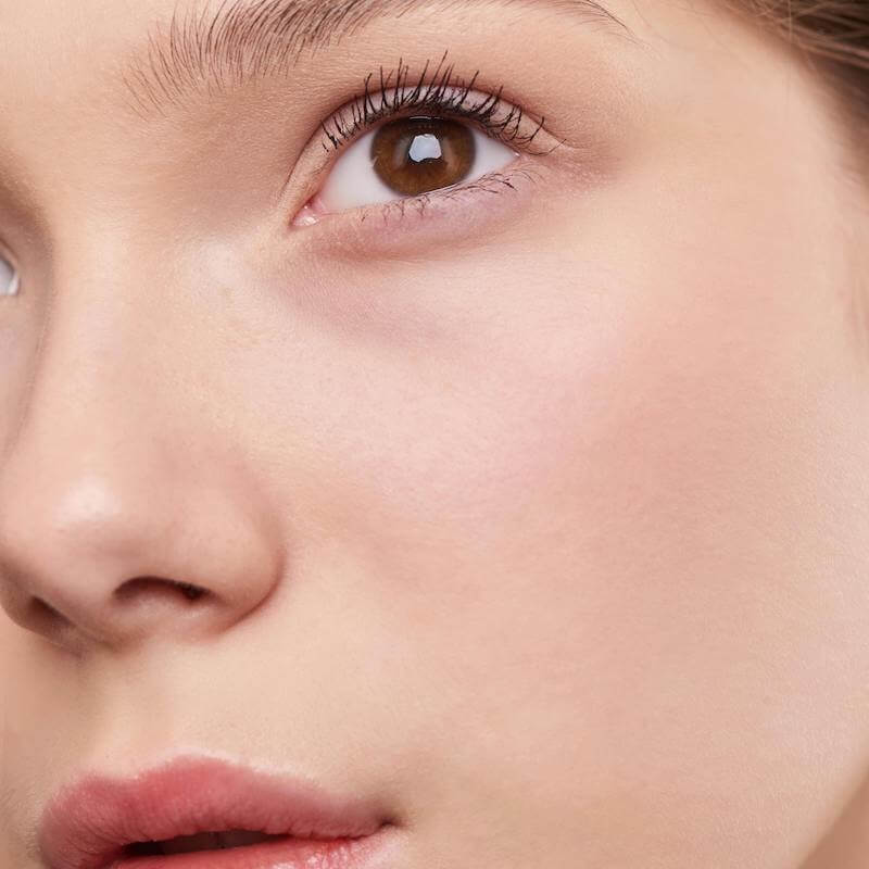 Young woman with clear skin representing skin health and wellness consultation at Bespoke Medical Aesthetics in Colchester