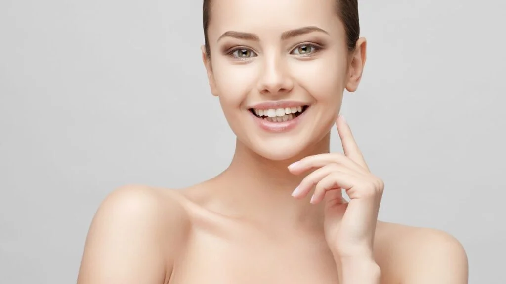 Woman with glowing skin which can be achieved with skinboosters in Colchester including profhilo, polynucleotides, skinvive and harmonyCa