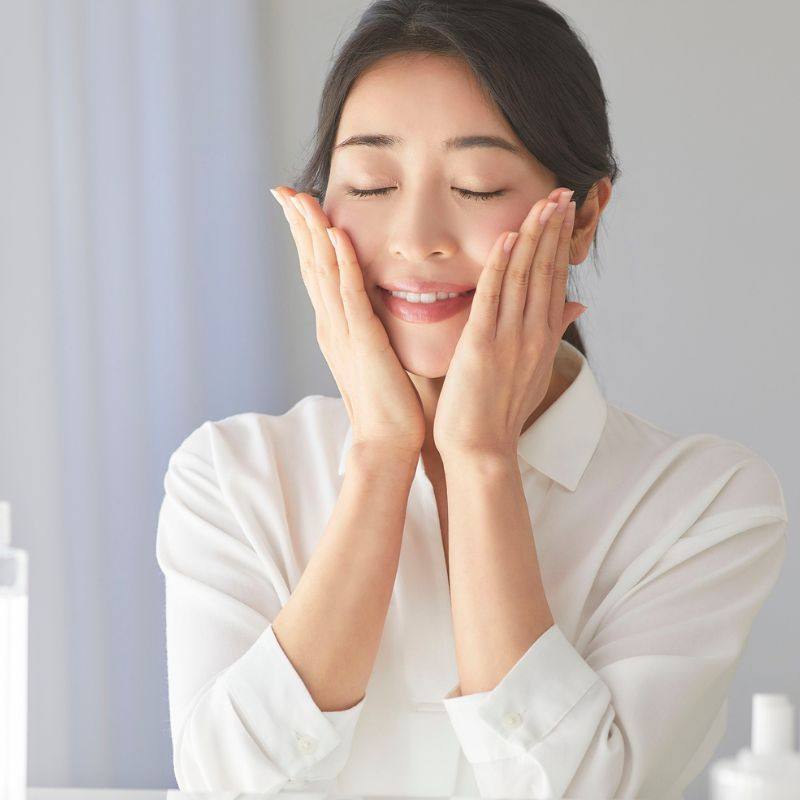 SkinVive Treatment in Colchester at Bespoke Medical Aesthetics. Image of a lady embracing her face after treatment.