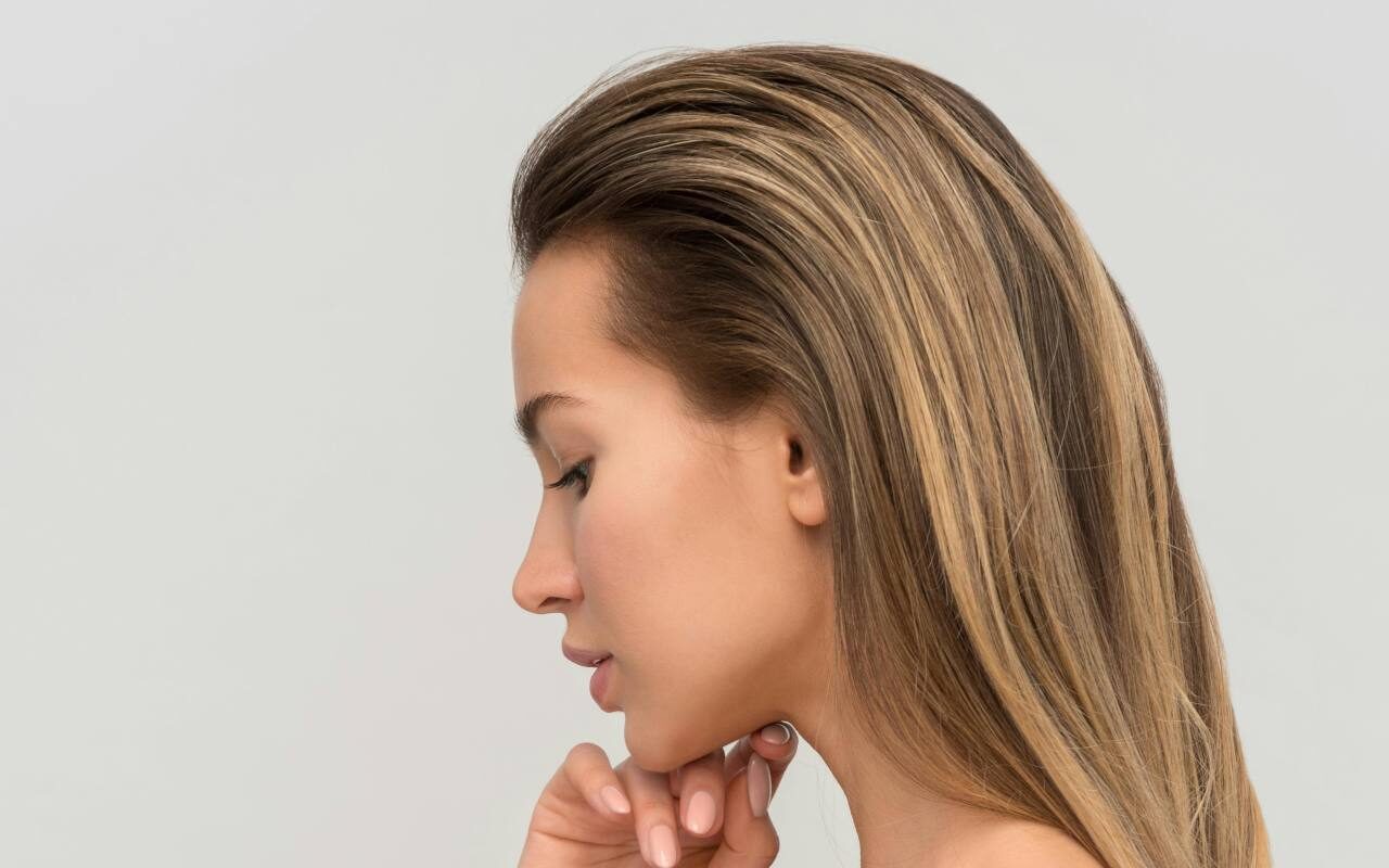 Woman with glowing hydrated skin after SkinVive treatment in Colchester at Bespoke Medical Aesthetics.